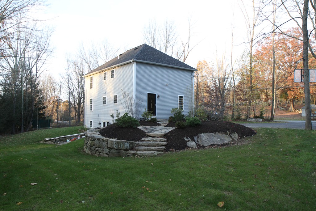 860 Podunk Road East Brookfield, MA 01515 - Photo 4 of 18 a view of a house with backyard and garden