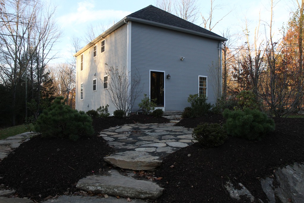 860 Podunk Road East Brookfield, MA 01515 - Photo 5 of 18 a backyard of a house with plants and trees