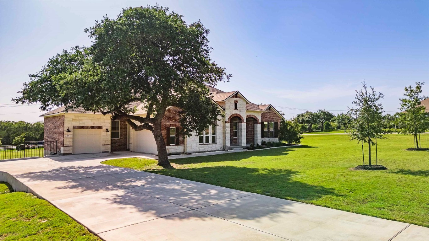 170 Call Drive Austin, TX 78737 - Photo 1 of 1 a view of a house with garden and a tree