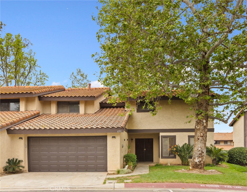 6591 Le Blan Way Riverside, CA 92506 - Photo 1 of 1 a front view of a house with a yard