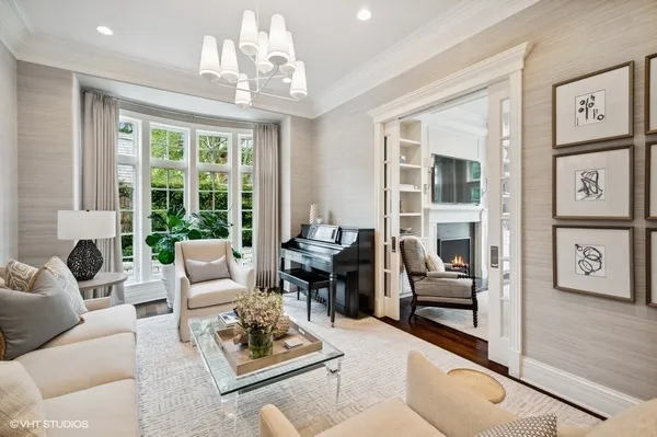 a living room with furniture dining table and a large window