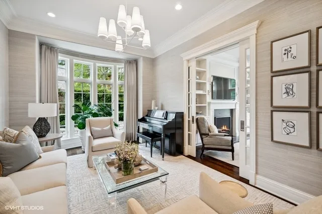 a living room with furniture dining table and a large window