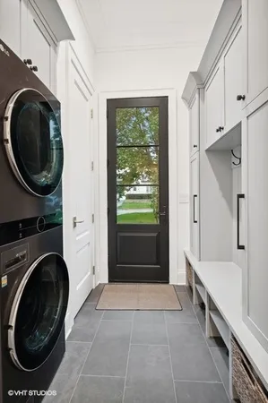 a view of a hallway with washer and dryer