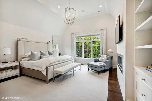 a bedroom with a bed couch and a window