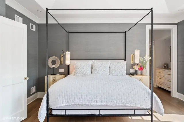 a bedroom with a bed and a mirror