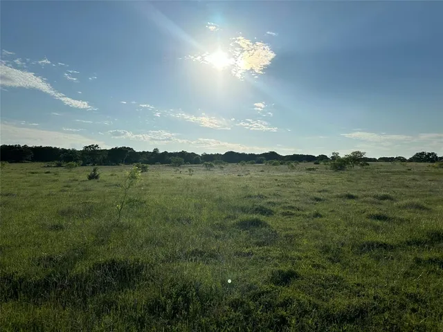 a view of a lake and sunset