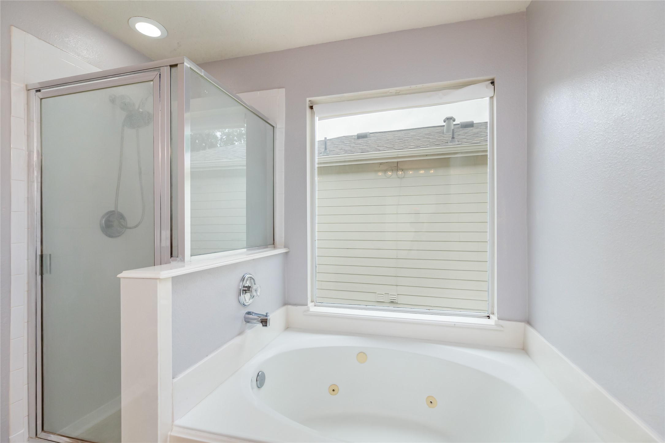 17334 Turquoise Stream Drive Houston, TX 77095 - Photo 20 of 31 a bathroom with a bathtub and a shower