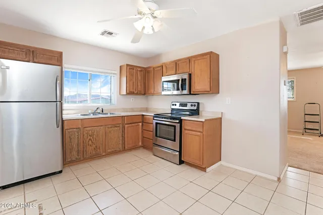 a bathroom with a sink a mirror and a shower