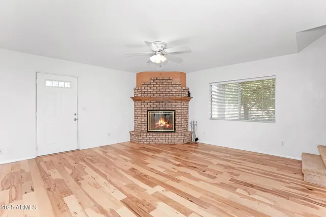 a view of a lake with houses in the back