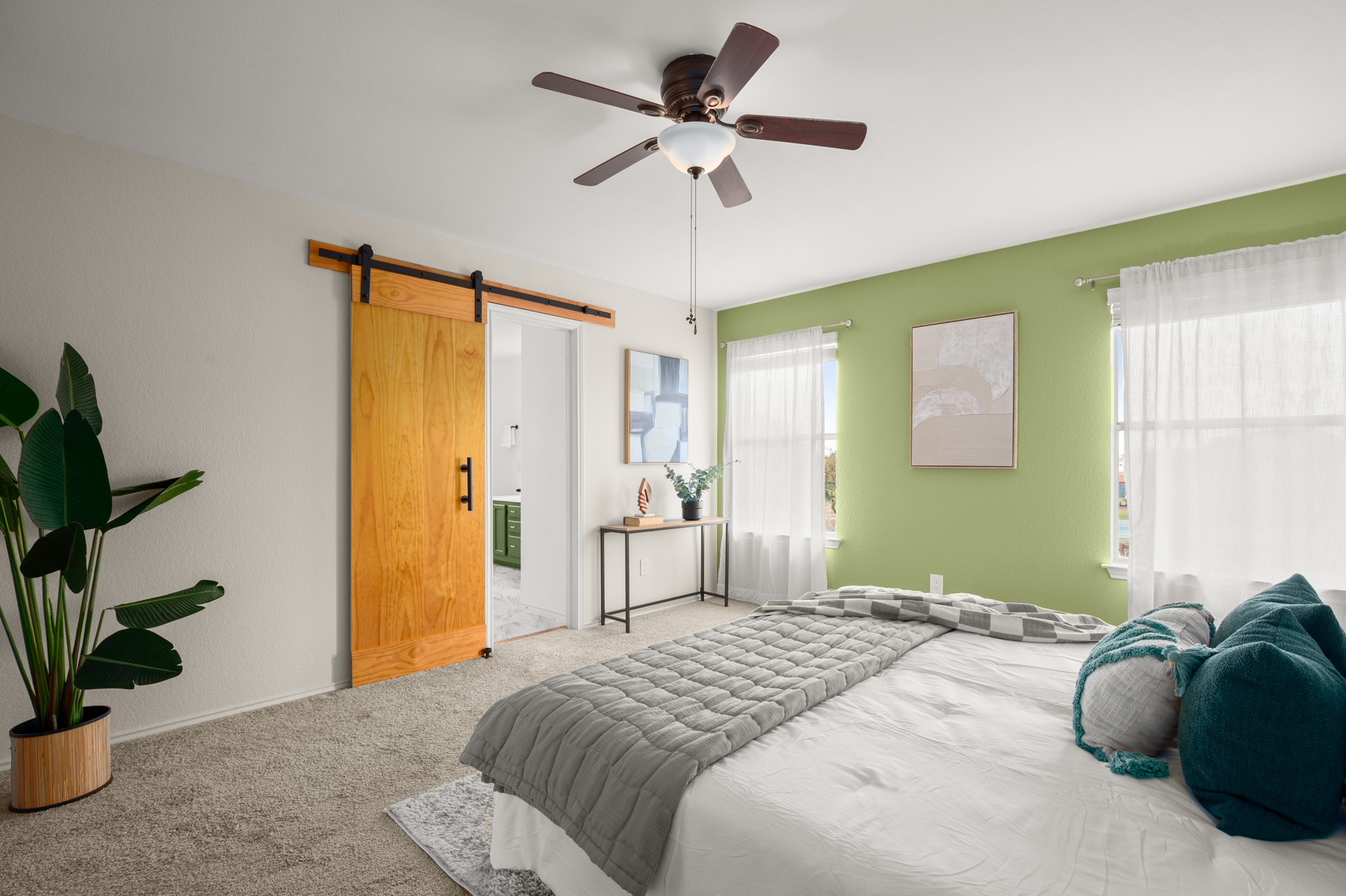 1302 Rambling Trail Cedar Park, TX 78613 - Photo 21 of 26 a bedroom with a bed and a potted plant