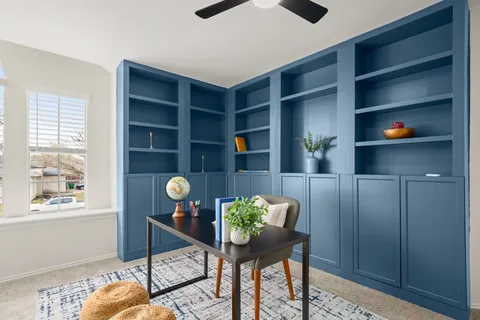 a workspace with furniture and window