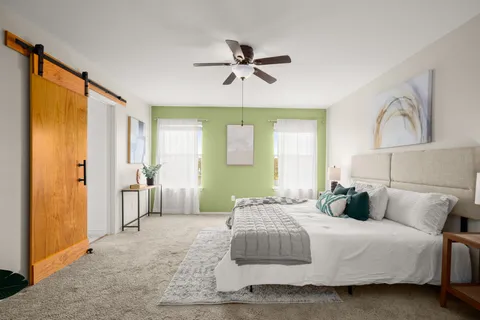 a bedroom with a bed and window