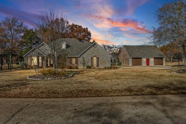 a view of a large house with a yard