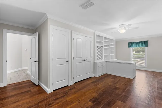 a view of kitchen with cabinets and wooden floor