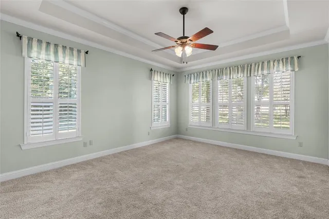 a spacious bedroom with a bed and a couch