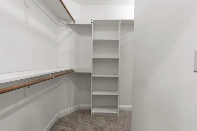 a view of an empty walk in closet