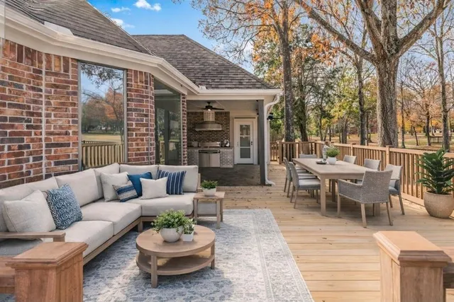 a view of a patio with a dining table and a chairs