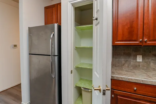 a bedroom with a bed and a television