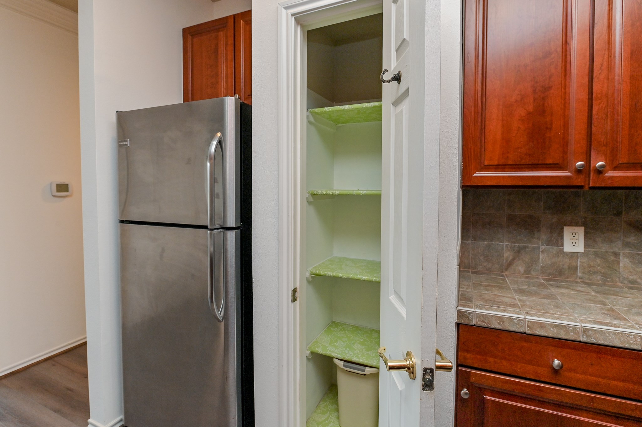 2400 McCue Road, Unit 443 Houston, TX 77056 - Photo 11 of 31 a view of walk in closet with wooden floor