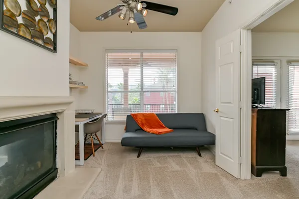 a bedroom with a large bed and a tv