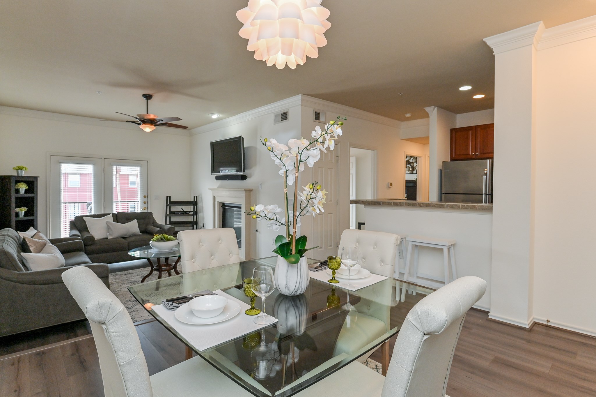 2400 McCue Road, Unit 443 Houston, TX 77056 - Photo 2 of 31 a view of a dining room with furniture a chandelier and wooden floor