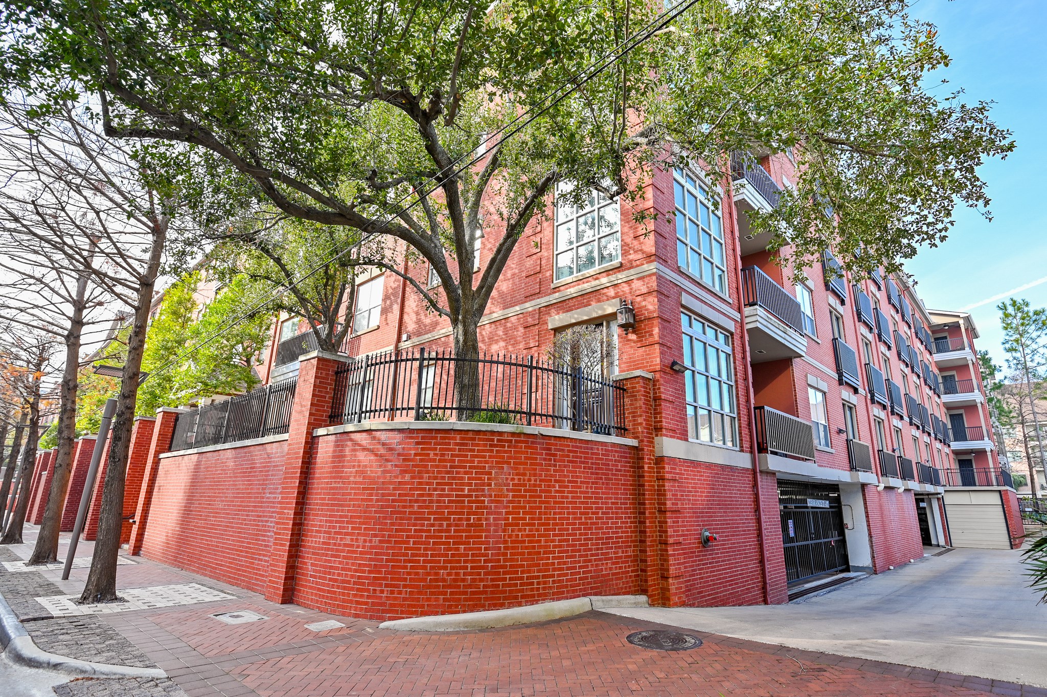 2400 McCue Road, Unit 443 Houston, TX 77056 - Photo 4 of 31 a view of a building with a tree