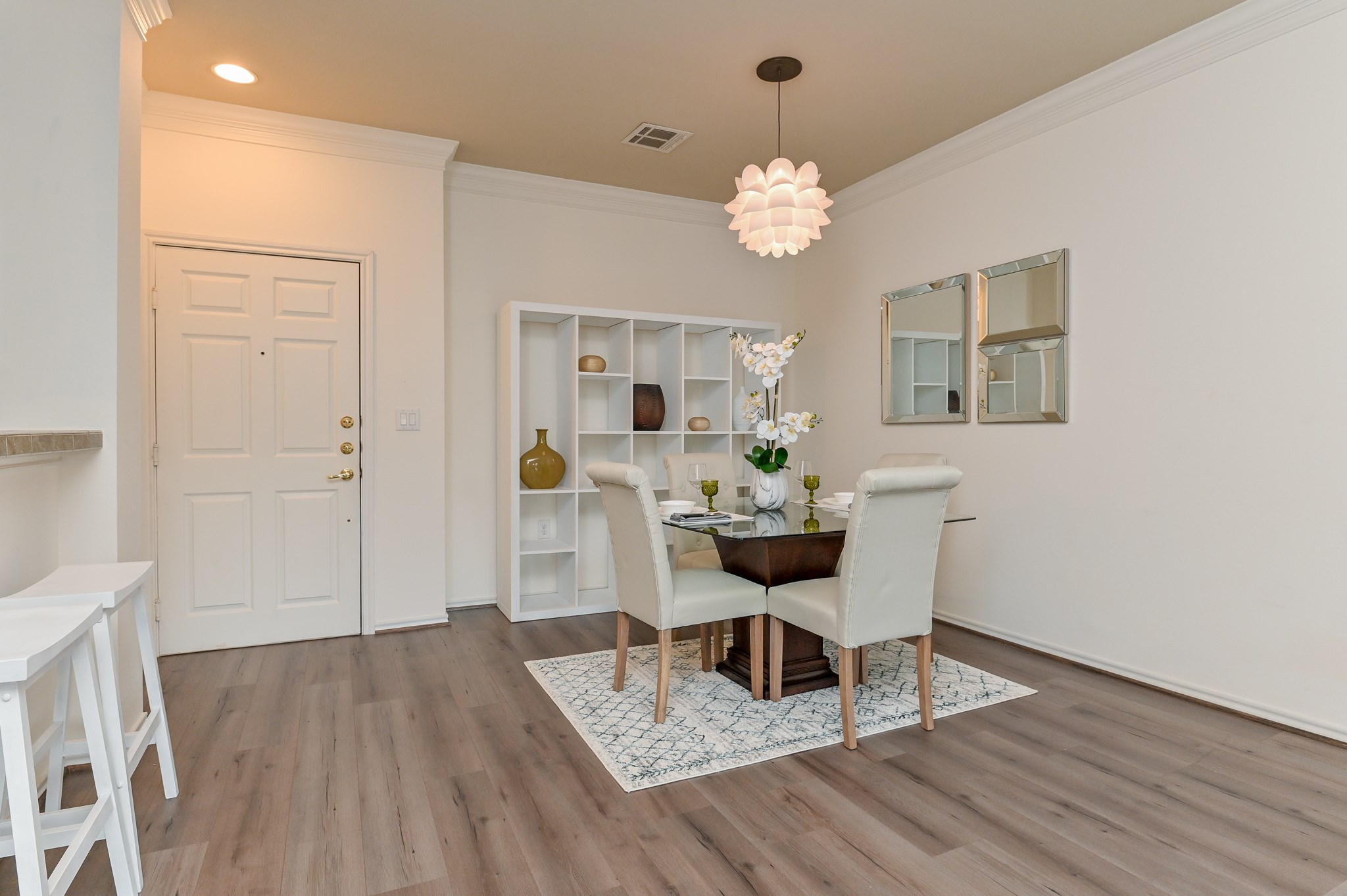 2400 McCue Road, Unit 443 Houston, TX 77056 - Photo 7 of 31 a view of a dining room with furniture and wooden floor