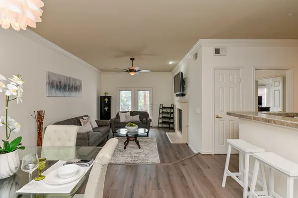a view of walk in closet with wooden floor