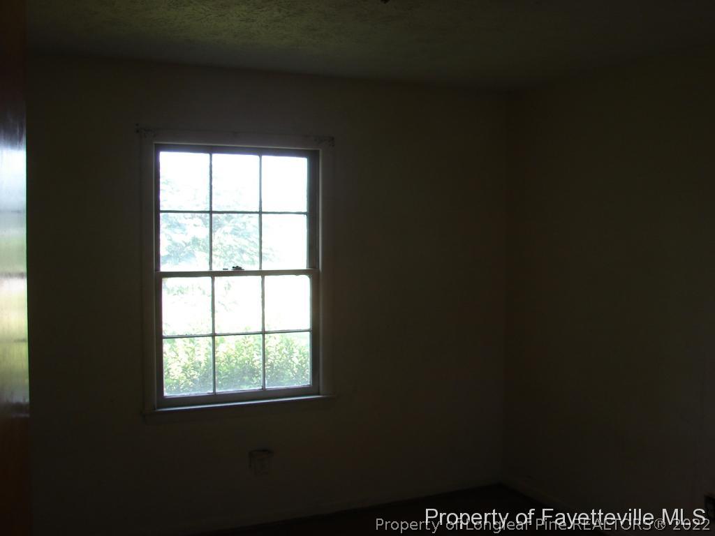 980 Carroll Store Road Autryville, NC 28318 - Photo 15 of 17 a view of an empty room with a window