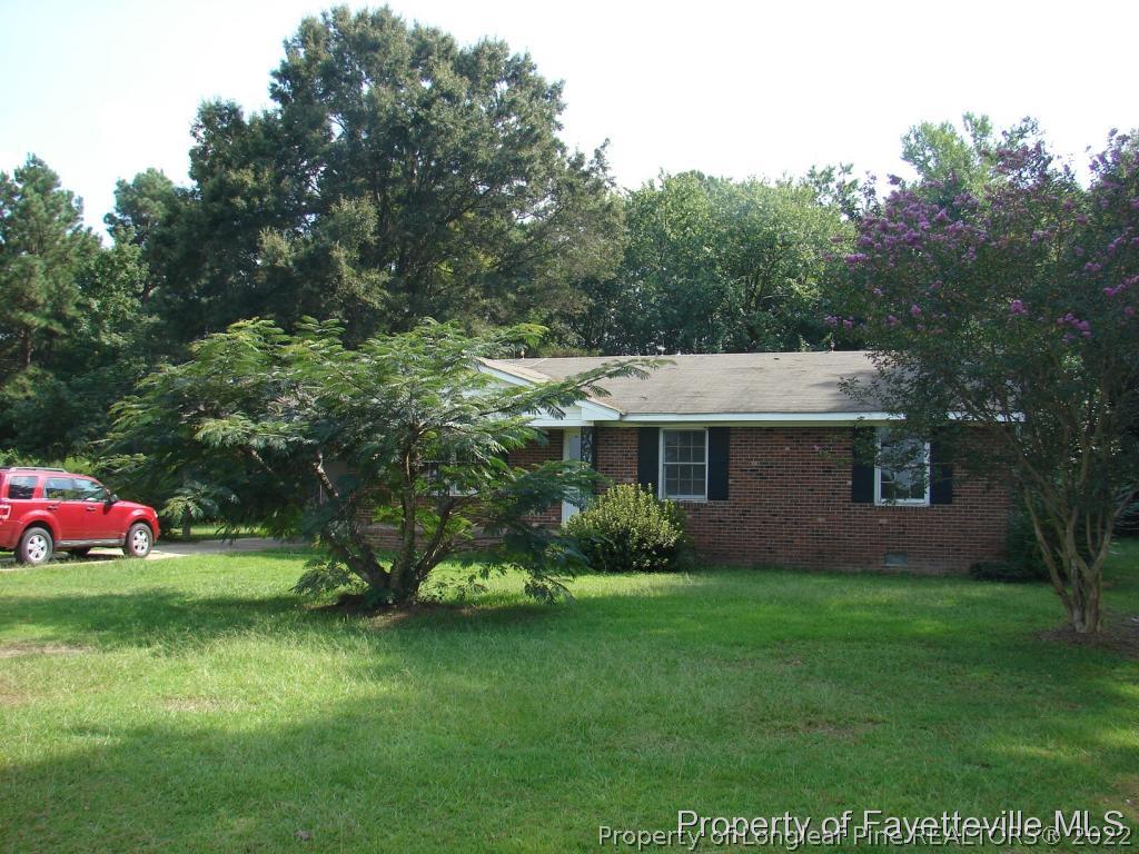 980 Carroll Store Road Autryville, NC 28318 - Photo 2 of 17 a view of a house with a yard