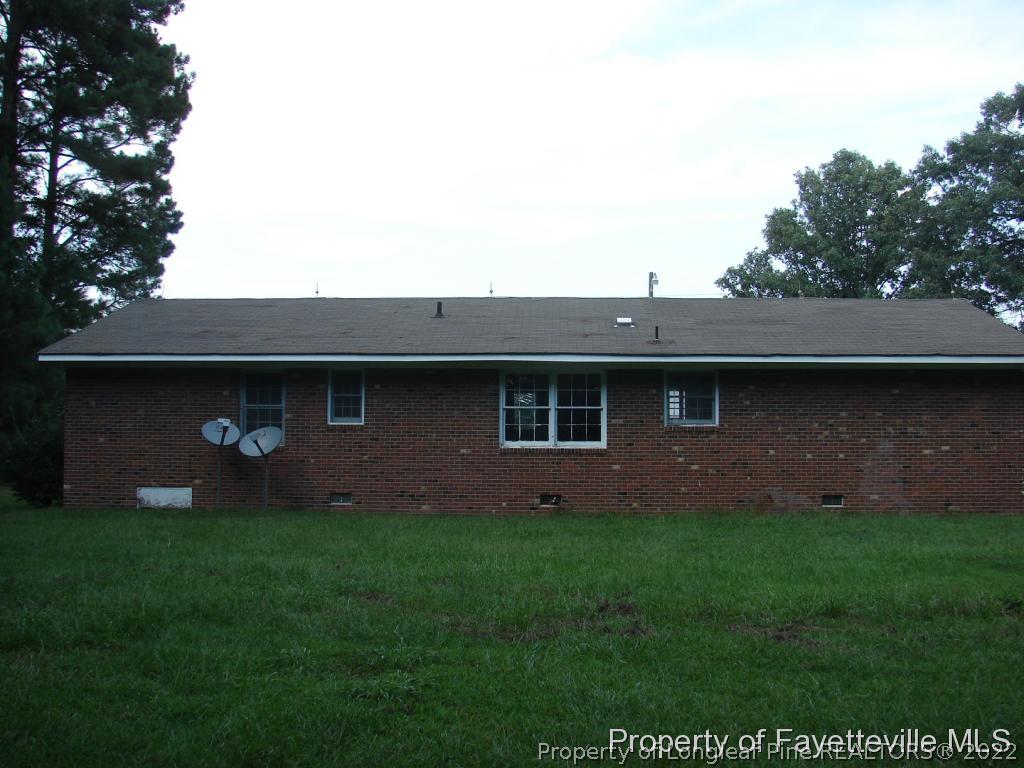 980 Carroll Store Road Autryville, NC 28318 - Photo 6 of 17 a backyard of a house with lots of green space