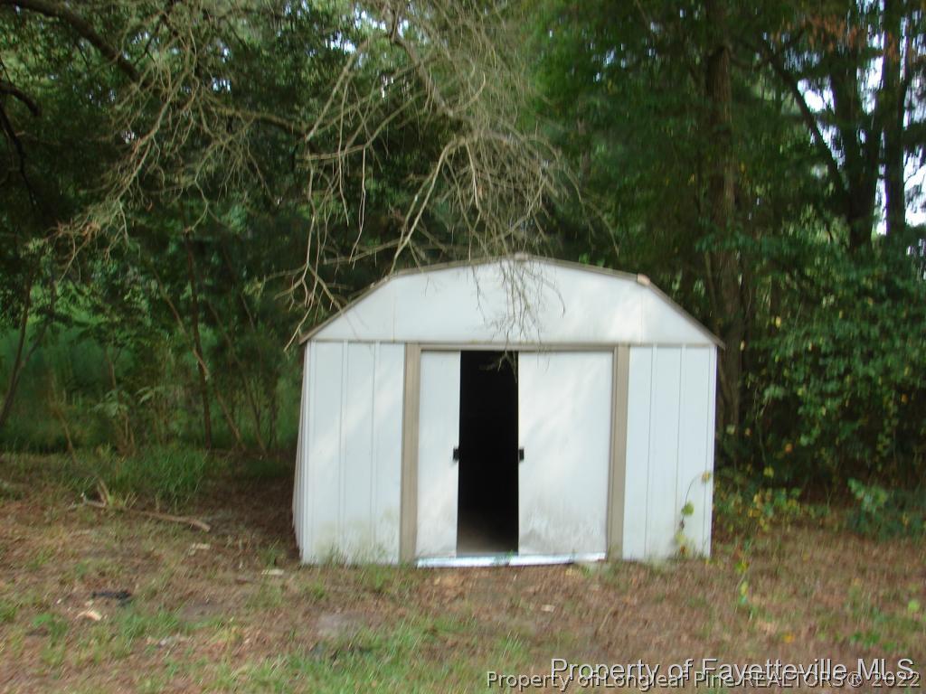980 Carroll Store Road Autryville, NC 28318 - Photo 7 of 17 a view of a small house