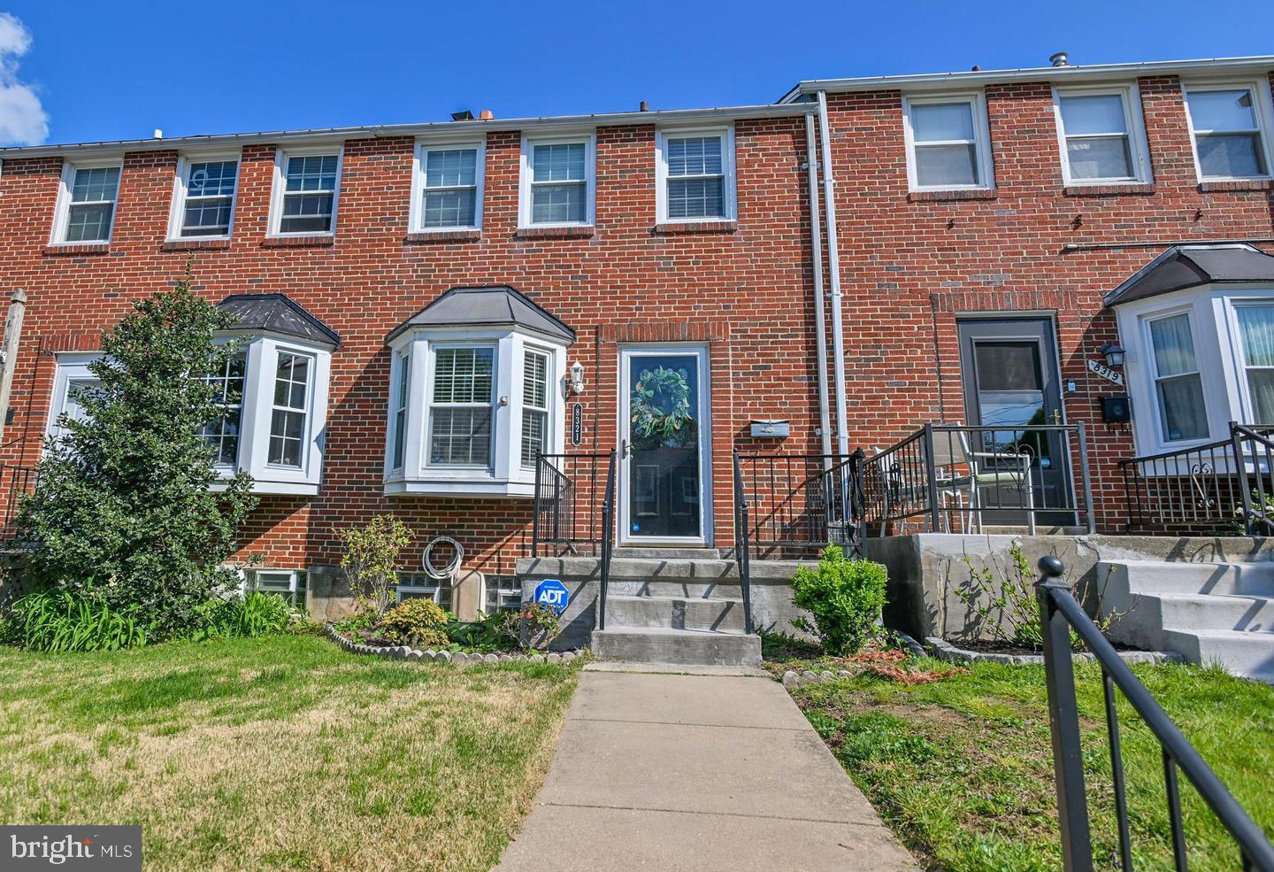 8321 Byington Road Towson, MD 21286 - Photo 1 of 28 a front view of a house with garden