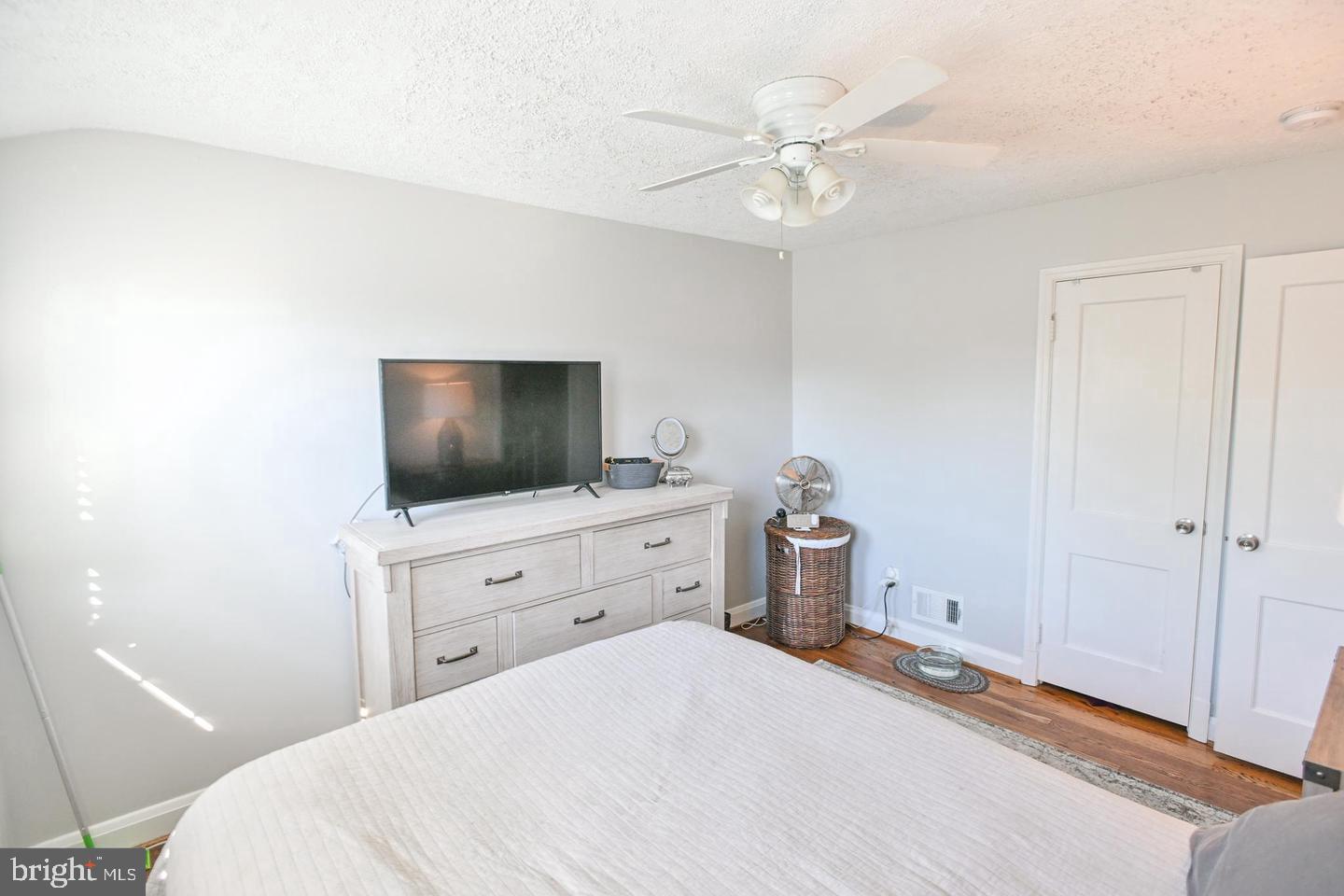 8321 Byington Road Towson, MD 21286 - Photo 12 of 28 a bedroom with a bed and a flat screen tv
