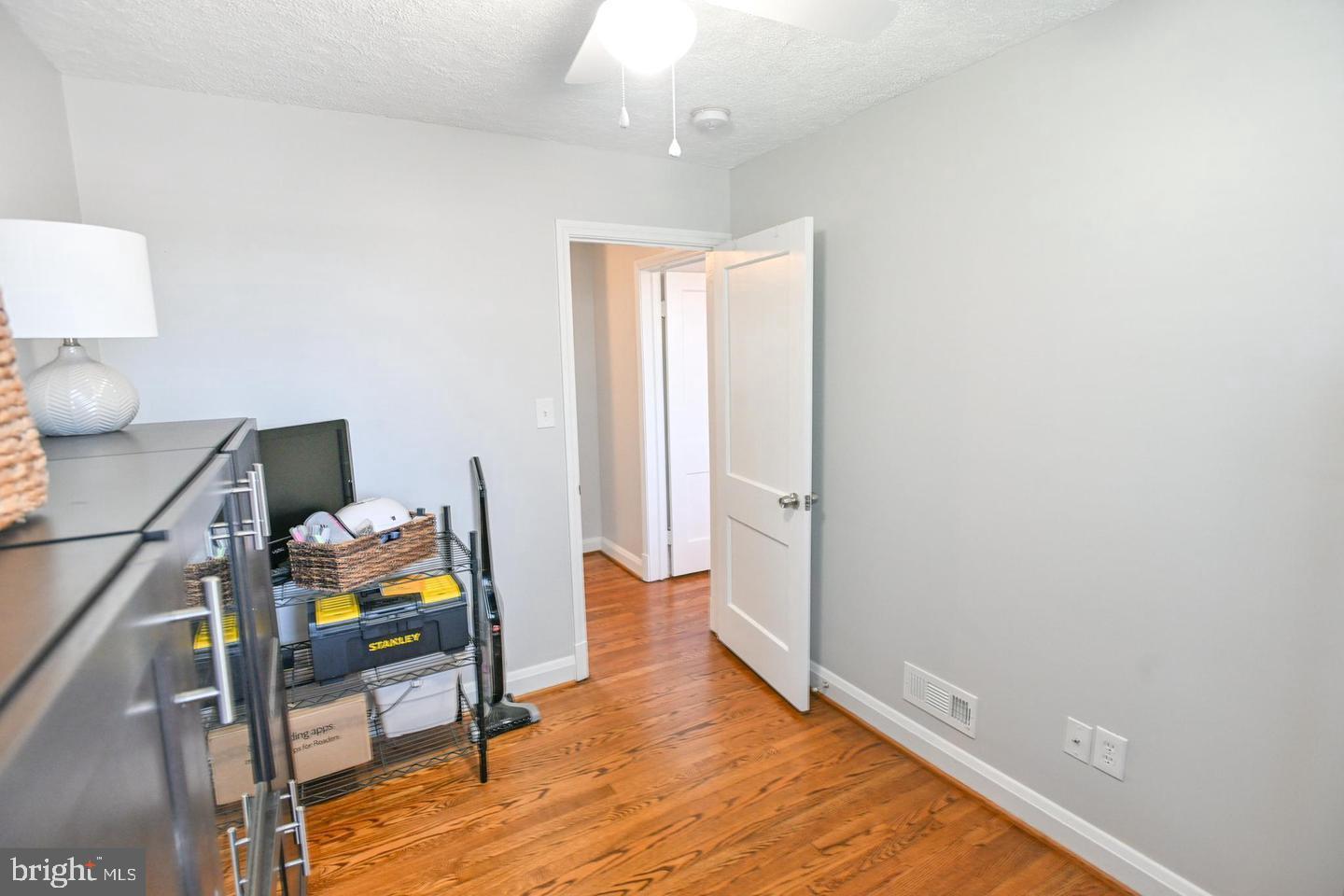 8321 Byington Road Towson, MD 21286 - Photo 18 of 28 a view of a workspace with furniture and wooden floor