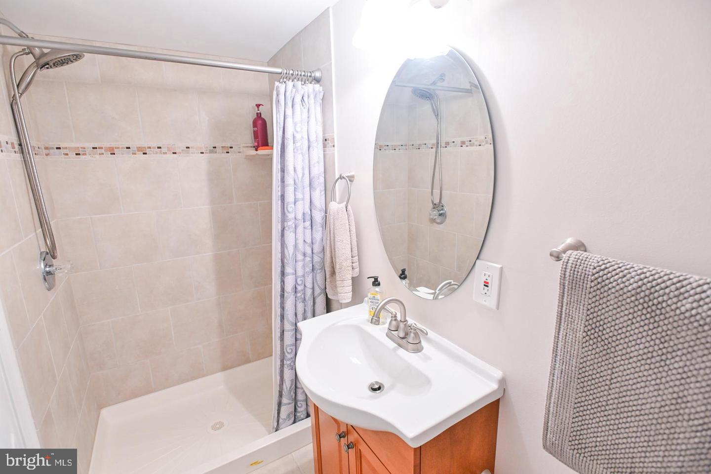 8321 Byington Road Towson, MD 21286 - Photo 23 of 28 a bathroom with a sink mirror toilet and shower