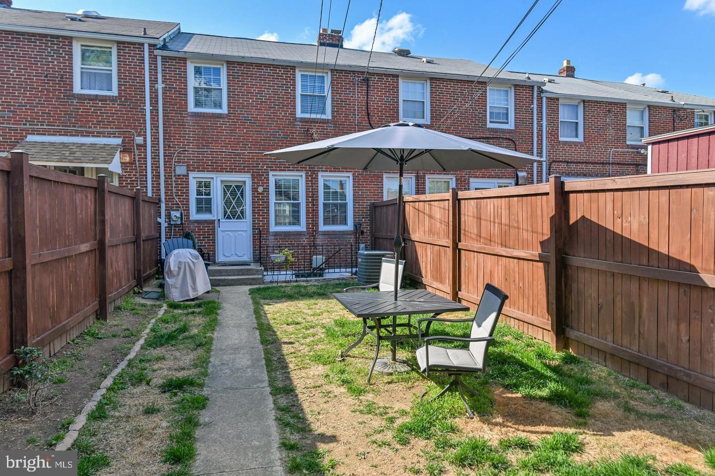 8321 Byington Road Towson, MD 21286 - Photo 25 of 28 a view of a house with backyard and sitting area