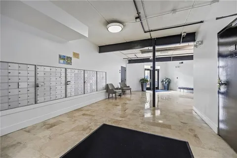 a view of a living room and hallway with seating area