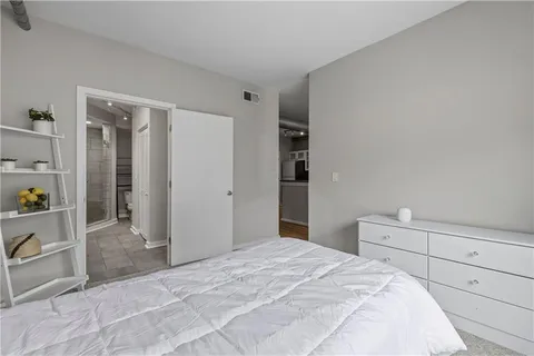 a bedroom with a bed and closet