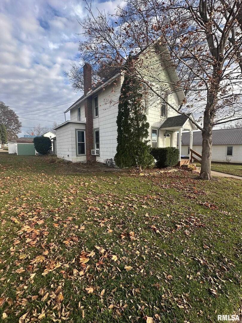 323 Lincoln Street Miles, IA 52064 - Photo 26 of 34 a view of a house with a yard