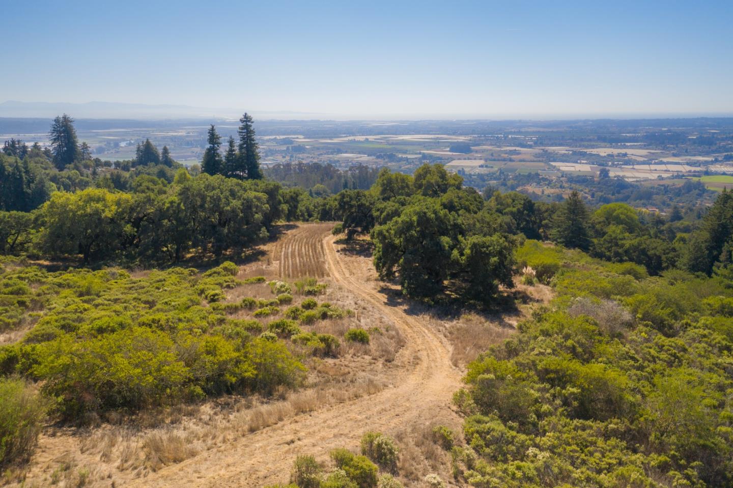 0 Hecker Pass Road Watsonville, CA 95076 - Photo 1 of 25 a view of a lake with a city