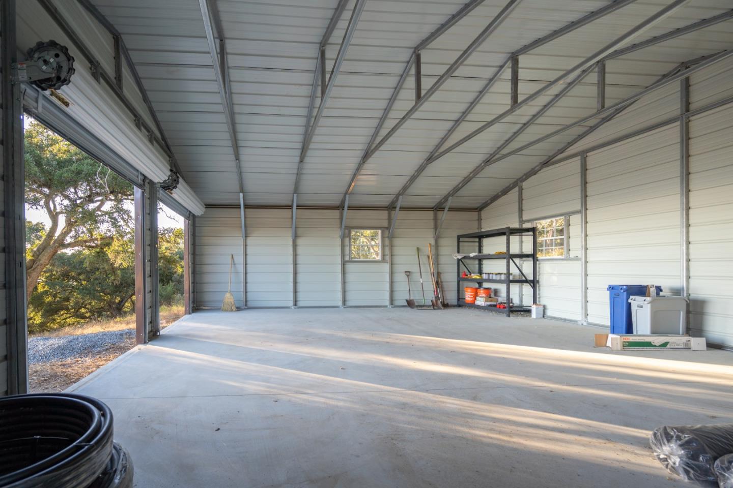 0 Hecker Pass Road Watsonville, CA 95076 - Photo 18 of 25 a spacious bedroom with a large bed and a large window