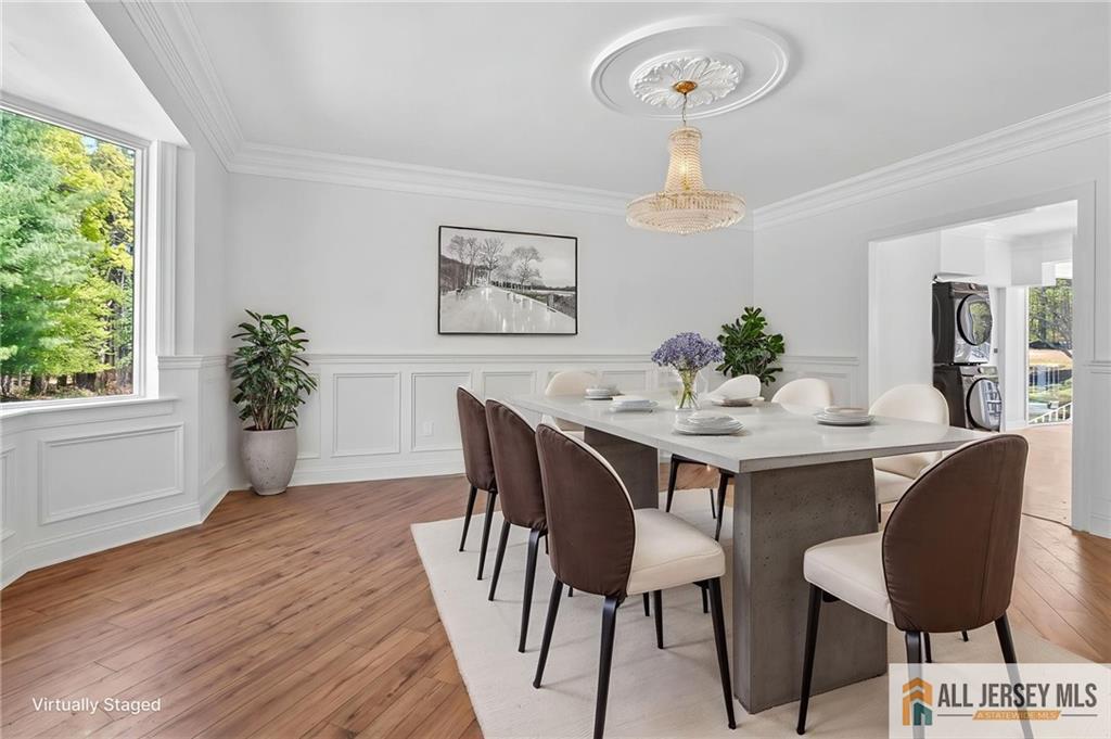 381 Monmouth Road Freehold, NJ 07728 - Photo 56 of 63 a view of a dining room with furniture window and wooden floor