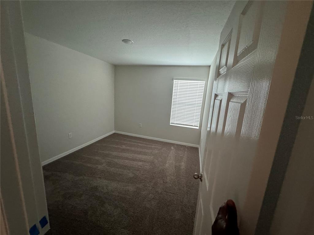 7629 Hydrangea Lane Wesley Chapel, FL 33545 - Photo 12 of 15 a view of empty room
