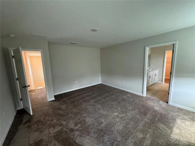 an empty room with a bathroom