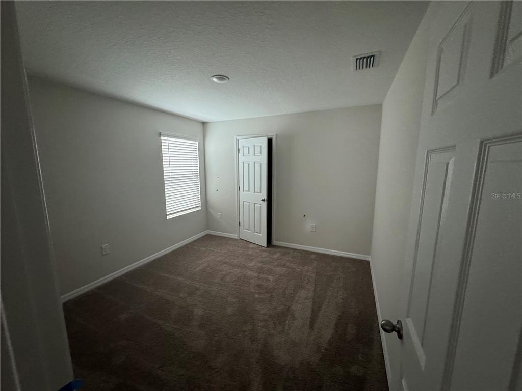 7629 Hydrangea Lane Wesley Chapel, FL 33545 - Photo 10 of 15 a view of empty room
