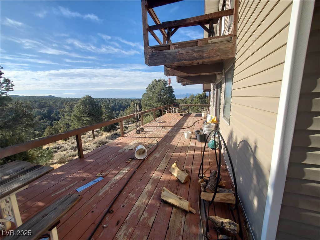 1281 Meadow Lane Pioche, NV 89043 - Photo 16 of 34 Wooden deck featuring a view of trees