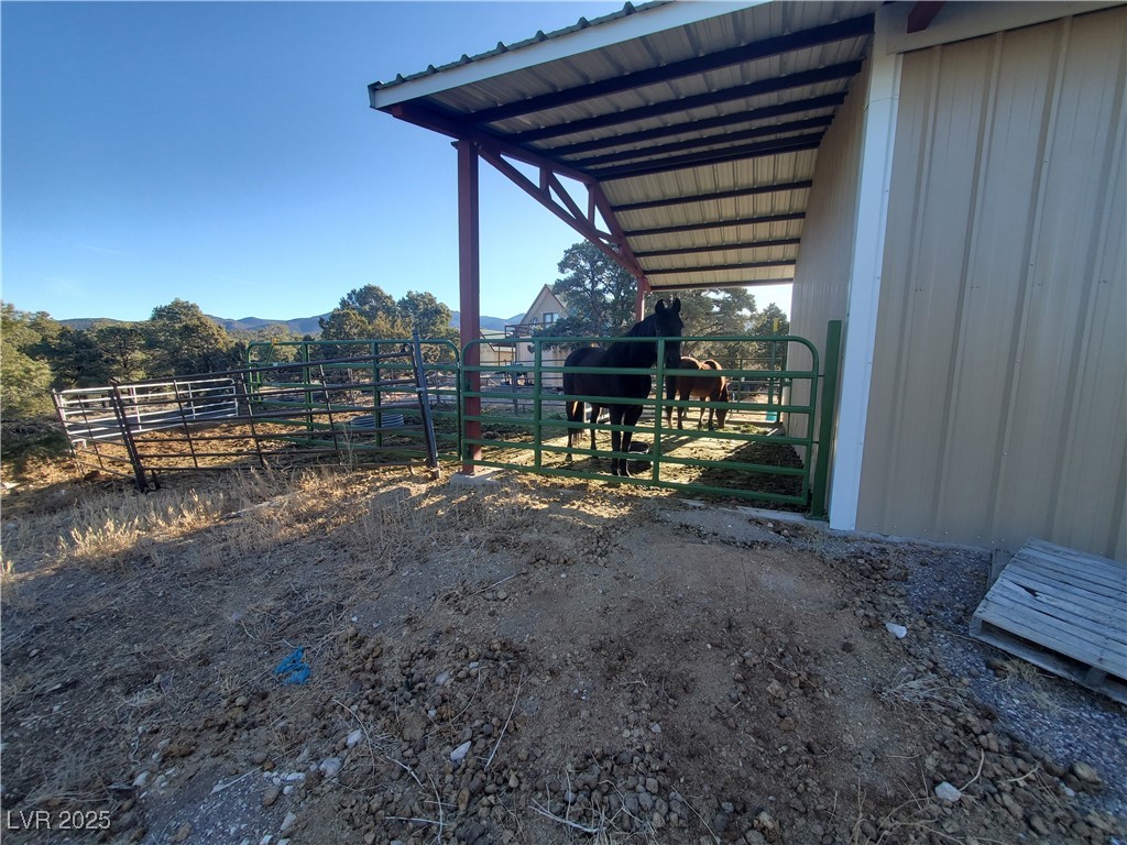 1281 Meadow Lane Pioche, NV 89043 - Photo 19 of 34 View of yard featuring a carport, an exterior structure, and an outdoor structure