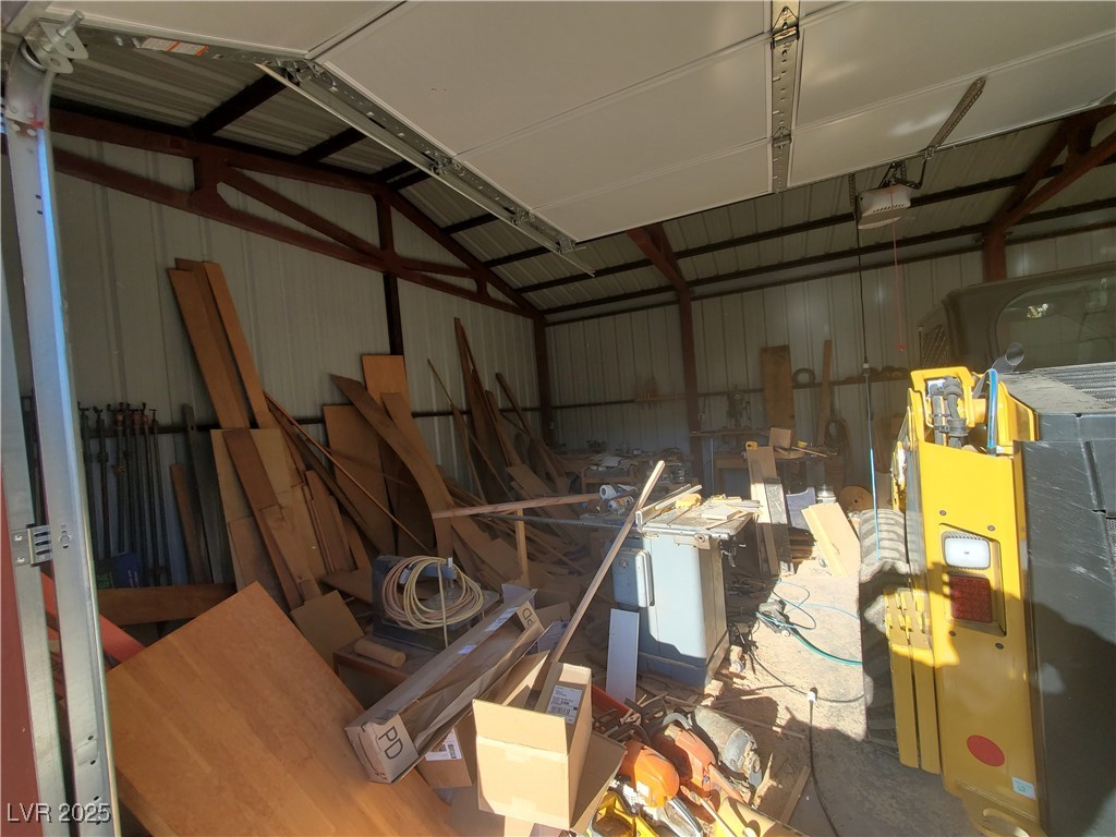 1281 Meadow Lane Pioche, NV 89043 - Photo 23 of 34 Garage with a garage door opener and metal wall