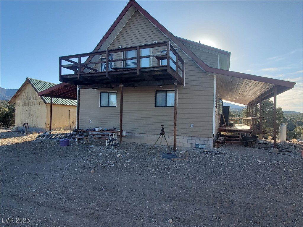 1281 Meadow Lane Pioche, NV 89043 - Photo 30 of 34 Rear view of property featuring a wooden deck